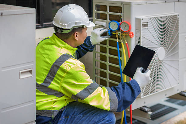 Professional Air Conditioning Repair technician working in Harvey, ND
